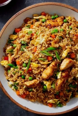 Plate of 25-minute Teriyaki Chicken Fried Rice garnished with green onions.