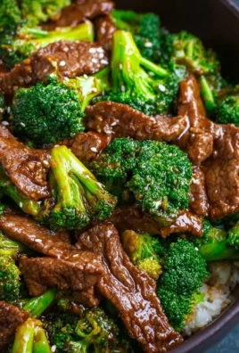 A delicious plate of beef and broccoli stir fry with vibrant vegetables.