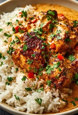 Delicious smothered chicken served over rice with creamy gravy.