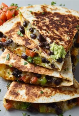 Delicious black bean veggie quesadilla filled with colorful vegetables.