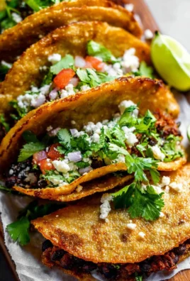 Crispy black bean tacos served with fresh toppings
