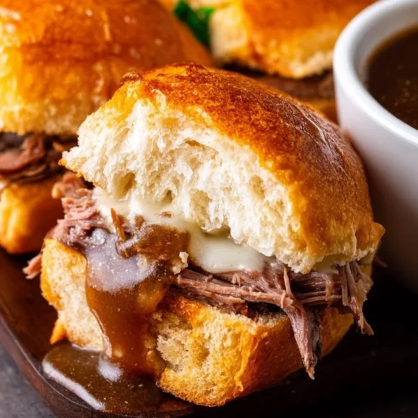 Delicious French Dip Sliders served with au jus for dipping.