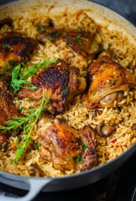 One Pot Chicken and Rice recipe served in a bowl with fresh herbs