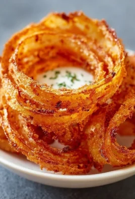 A bowl of crispy onion ring chips for snacking and enjoying with dips.