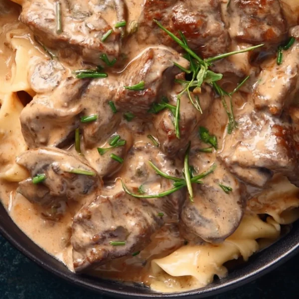 Delicious Beef Stroganoff served on a plate with creamy sauce and mushrooms