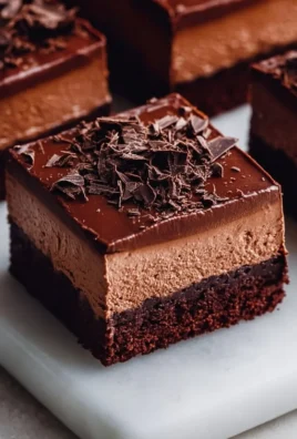 Delicious chocolate mousse brownies topped with creamy chocolate ganache