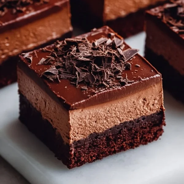 Delicious chocolate mousse brownies topped with creamy chocolate ganache