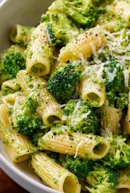 Bowl of Easy Healthy Broccoli Pasta topped with parmesan cheese