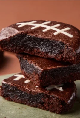 Fudgy football brownies decorated for a game day celebration