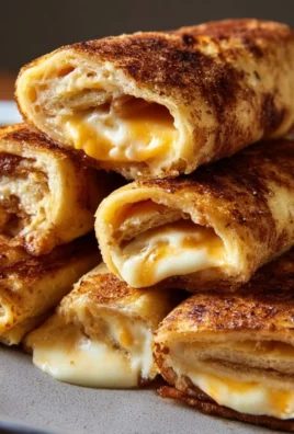 Delicious grilled cheese roll ups served with dipping sauce