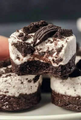 Healthy no-bake Oreo cheesecake bites on a plate garnished with mint