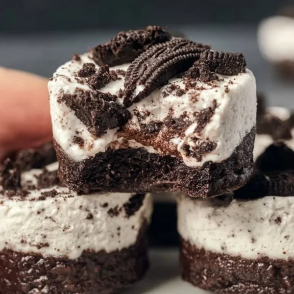 Healthy no-bake Oreo cheesecake bites on a plate garnished with mint