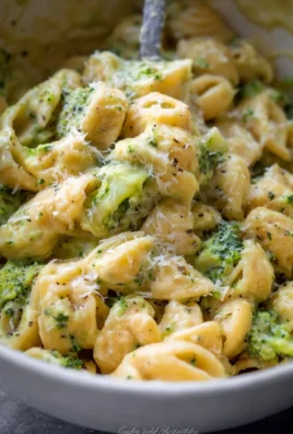Healthy one pot broccoli mac and cheese dish topped with cheese and broccoli