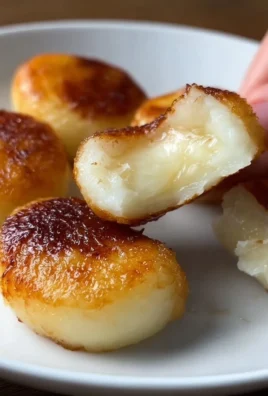 Delicious homemade potato mochi served on a plate with dipping sauce