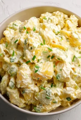 Delicious homemade potato salad in a bowl with fresh herbs and spices