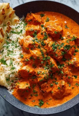 Delicious homemade butter chicken served with rice and naan