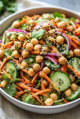 Asian cucumber and chickpea slaw topped with sesame dressing