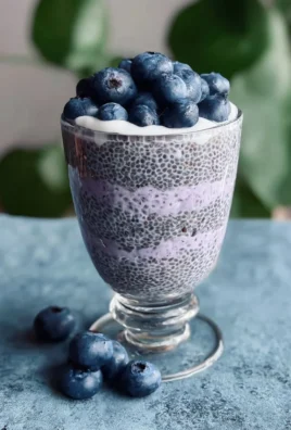 Delicious bowl of blueberry chia pudding topped with fresh blueberries
