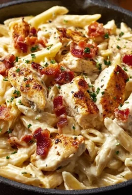 Delicious Chicken Bacon Ranch Pasta served in a bowl with herbs