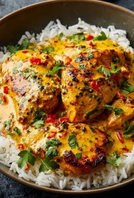 Creamy peri-peri chicken with rice on a plate
