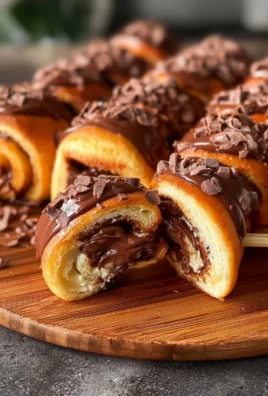 A plate of crispy chocolate rolls, golden brown and deliciously sweet