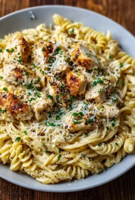 Delicious Crockpot Garlic Parmesan Chicken Pasta served in a bowl.