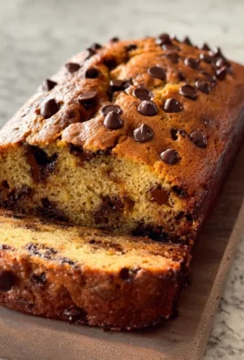 Delicious easy banana bread with chocolate chips on a wooden table