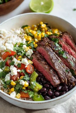 Delicious Flank Steak Bowl with fresh vegetables and flavorful dressing
