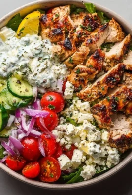 Healthy Greek Chicken Bowl with fresh vegetables and flavorsome dressing