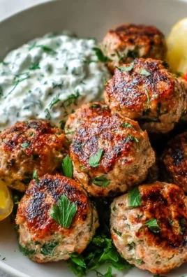 Plate of Greek turkey meatballs served with tzatziki sauce