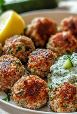 Plate of Greek turkey meatballs with tzatziki sauce and fresh herbs
