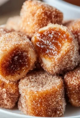 Healthy air fryer churro bites served on a plate with a cinnamon-sugar dusting