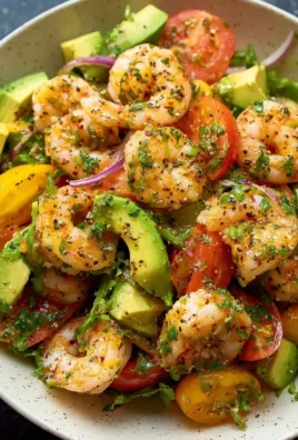 Healthy shrimp avocado salad with fresh ingredients on a plate