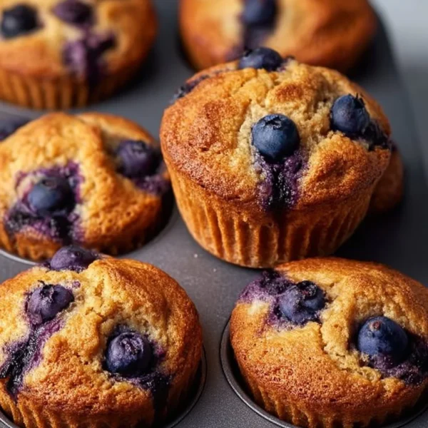 Delicious hearty blueberry protein muffins in a rustic setting