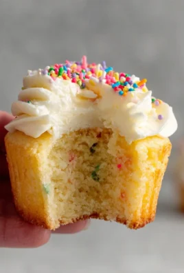 Homemade Funfetti Cupcakes with colorful sprinkles on top