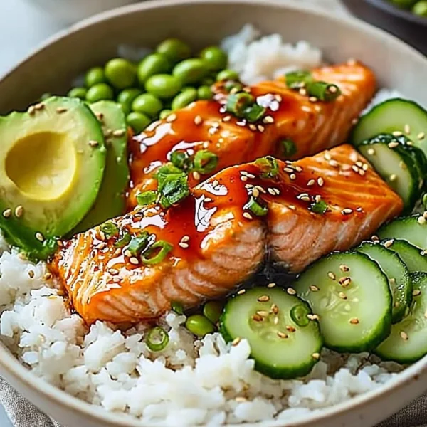 Honey Sriracha Salmon bowl with vibrant vegetables and grains