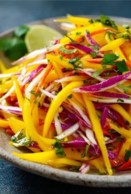 Colorful Mango Slaw with fresh ingredients and zesty dressing served in a bowl