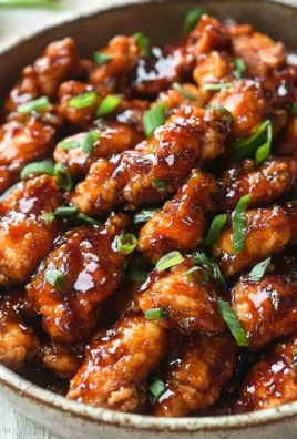 Delicious Mongolian chicken with crispy fried chicken coated in savory sauce.