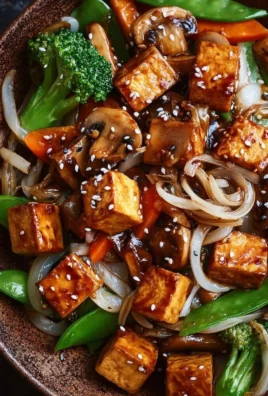 Delicious mushroom tofu stir-fry with vibrant vegetables and savory sauce.
