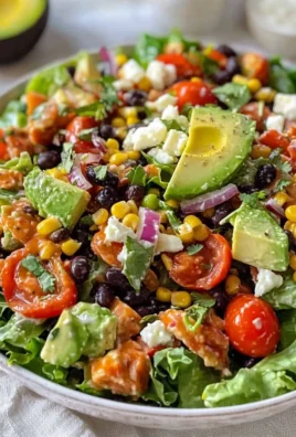 Colorful Santa Fe Salad with fresh vegetables, beans, and dressing