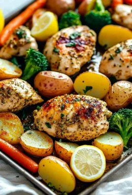 Sheet pan lemon herb chicken with mixed vegetables ready to serve