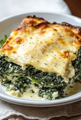 Creamy spinach gratin dish topped with cheese and baked to perfection