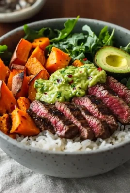 Steak and Sweet Potato Bowls with Avocado-Cilantro Drizzle served in a bowl