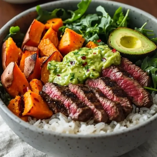 Steak and Sweet Potato Bowls with Avocado-Cilantro Drizzle served in a bowl