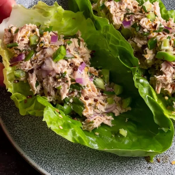 Freshly made tuna lettuce wraps filled with veggies and tuna salad