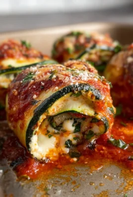 Delicious Zucchini Rollatini filled with cheese and herbs.