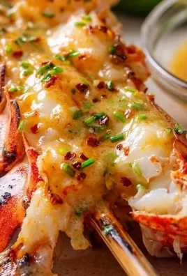 Grilled lobster tail skewers ready to serve on a barbecue grill