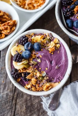 Healthy acai bowl topped with fruits and granola