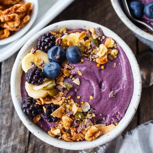 Healthy acai bowl topped with fruits and granola