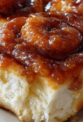 Freshly baked apple butter cinnamon rolls topped with icing